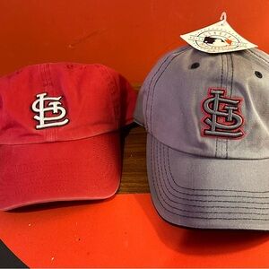Two St. Louis Cardinals baseball hats